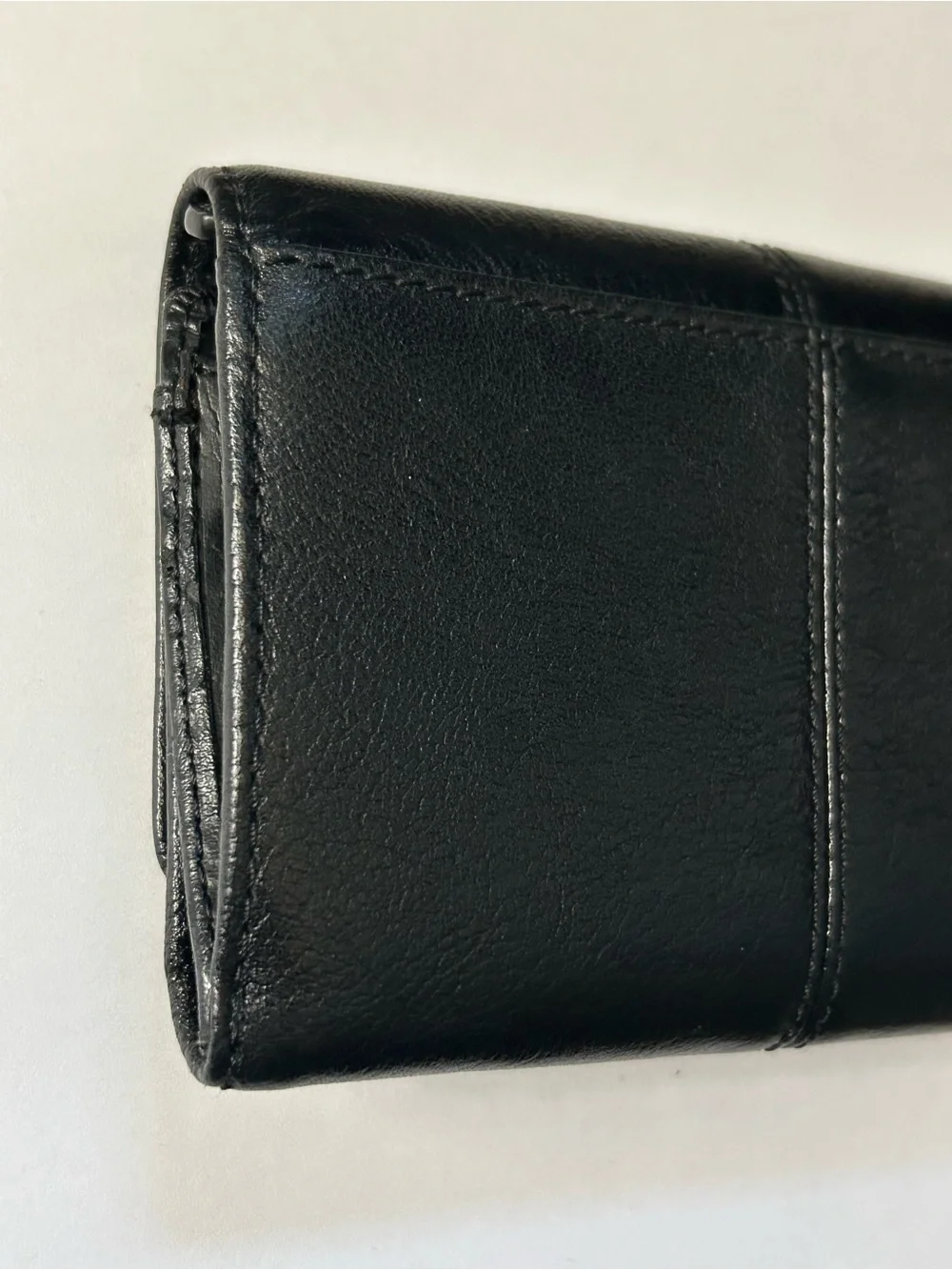 Coach Women’s Black Tri-Fold Wallet with Gold Script Logo